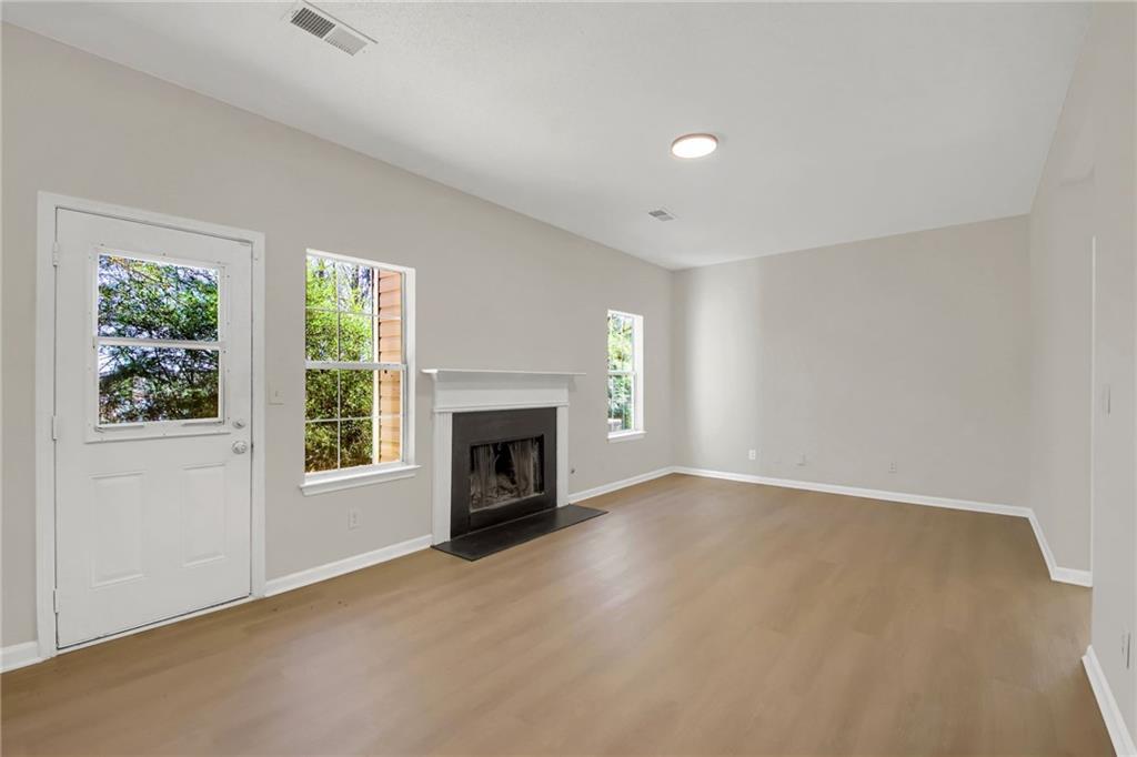 6566 Shaffers Way Lithonia, GA 30058 - Photo 13 of 31 an empty room with windows