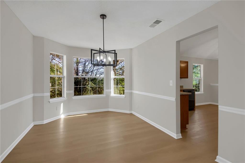 6566 Shaffers Way Lithonia, GA 30058 - Photo 5 of 31 a view of an empty room with window and chandelier