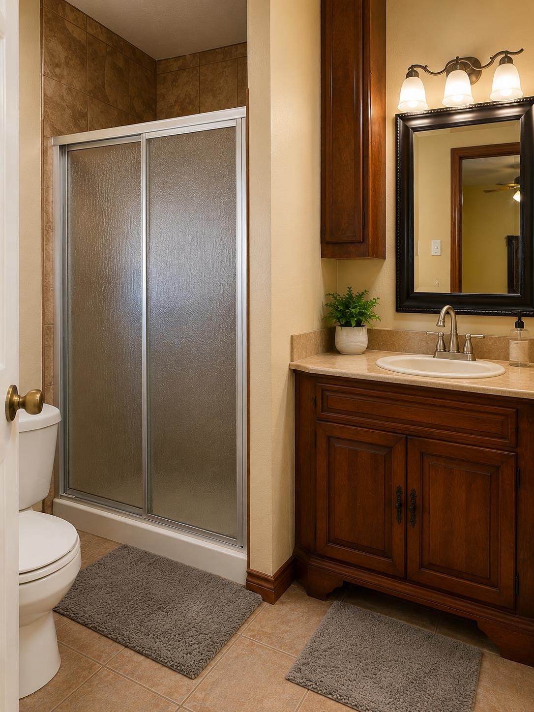 5845 Meadowview Road Beaumont, TX 77708 - Photo 20 of 24 a bathroom with a sink a toilet and shower