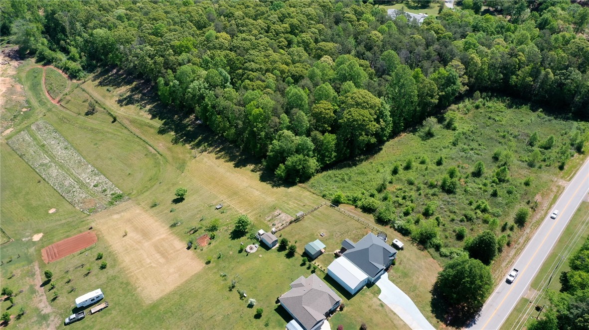 696 Mt Olivet Road Six Mile, SC 29682 - Photo 27 of 35 Expansive acreage provides a verdant backdrop for private living with ample space.