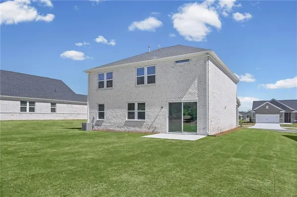 a view of grassy field with lots of trees
