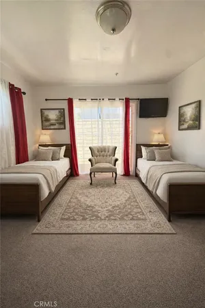 a bedroom with a bed and a couch