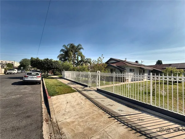 a view of a balcony with yard