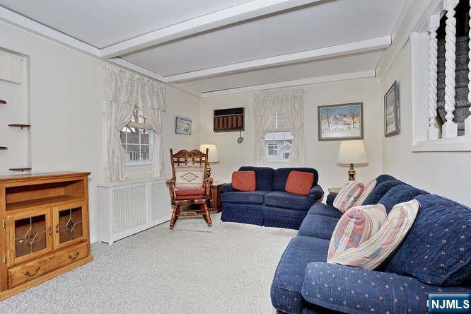 22-09 Arcadia Road Fair Lawn, NJ 07410 - Photo 2 of 28 a living room with furniture and a fireplace
