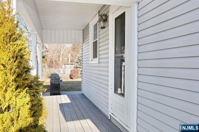22-09 Arcadia Road Fair Lawn, NJ 07410 - Photo 22 of 28 a view of balcony and wooden floor