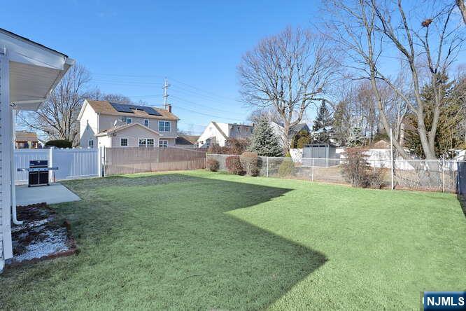 22-09 Arcadia Road Fair Lawn, NJ 07410 - Photo 25 of 28 a view of a house with a yard