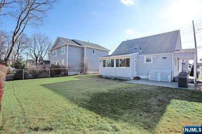 22-09 Arcadia Road Fair Lawn, NJ 07410 - Photo 26 of 28 a house view with a garden space