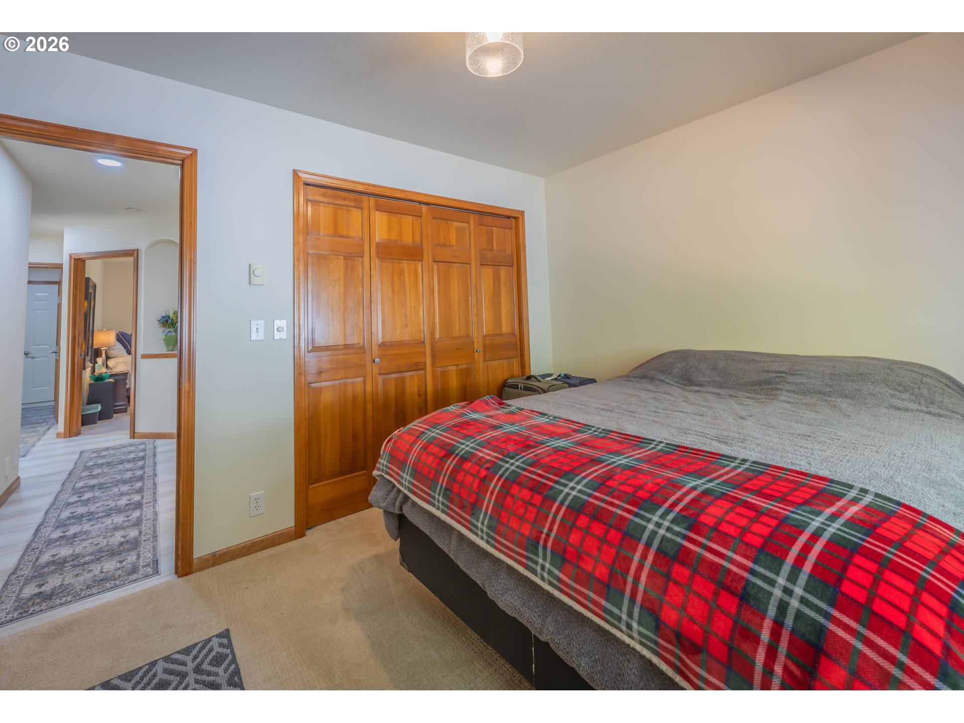 2193 13th Street Florence, OR 97439 - Photo 43 of 48 a bedroom with a bed and wooden floor