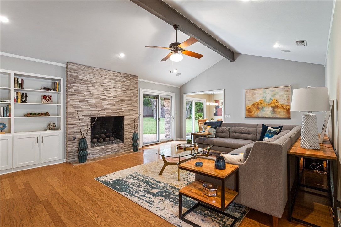 7511 Stonecliff Circle Austin, TX 78731 - Photo 1 of 1 a living room with furniture and a fireplace