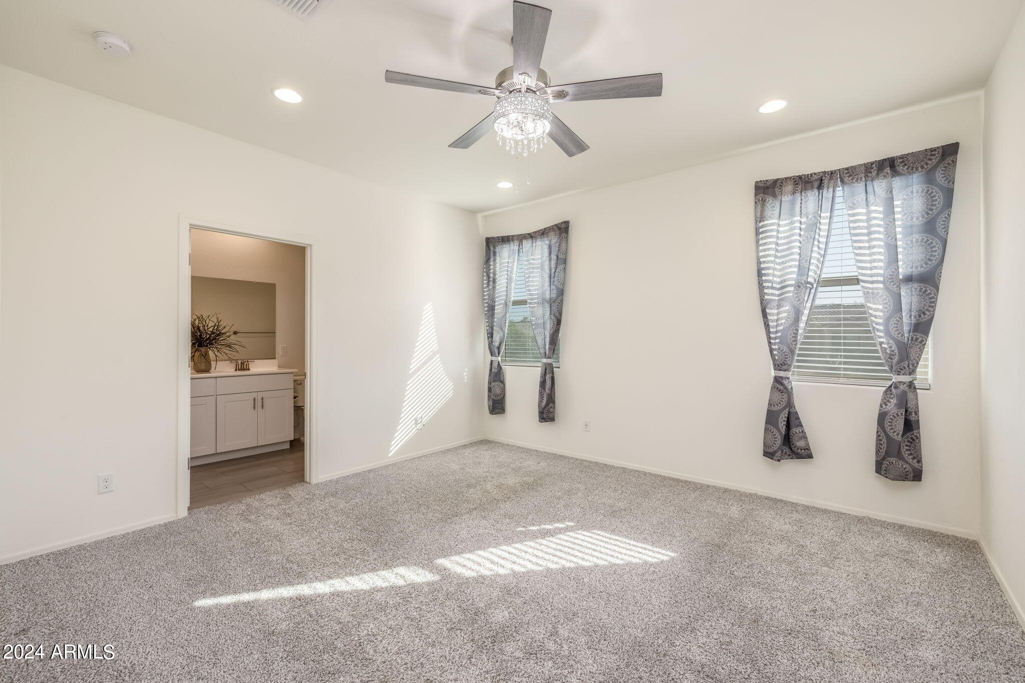 20810 North Gardenia Road Maricopa, AZ 85138 - Photo 18 of 42 Primary Suite with window treatments...