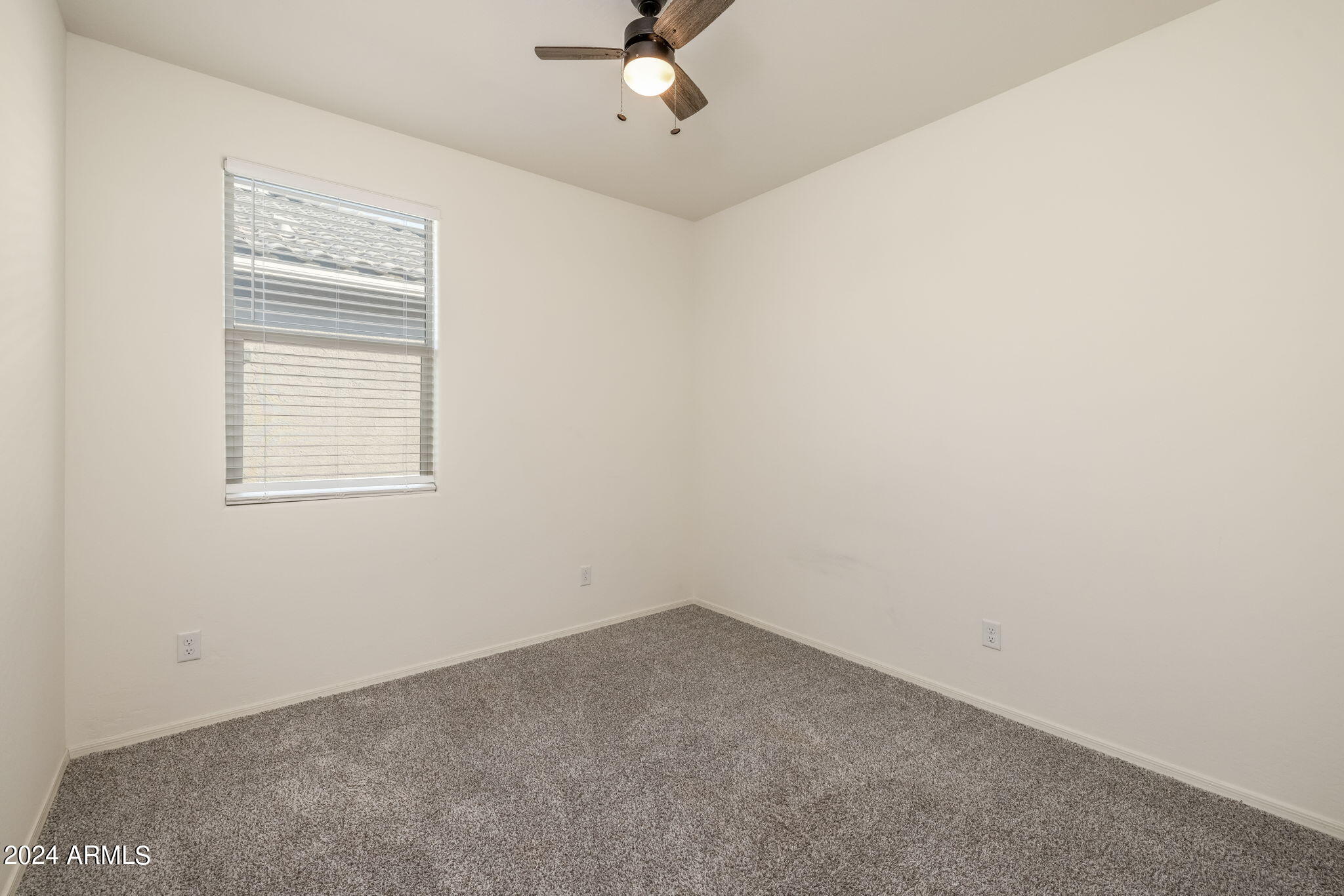 20810 North Gardenia Road Maricopa, AZ 85138 - Photo 21 of 42 Bedroom 2 with blinds and fan