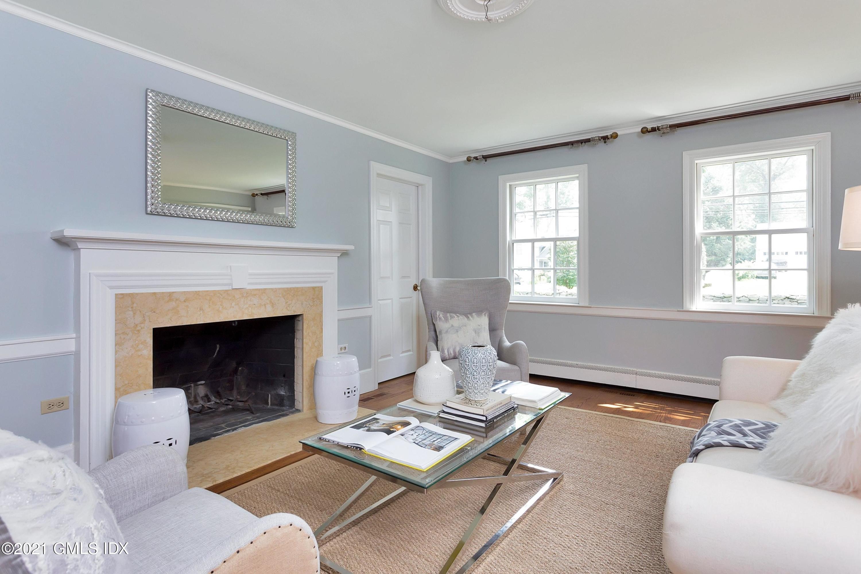 119 Lockwood Road Riverside, CT 06878 - Photo 9 of 40 a living room with furniture and a fireplace