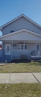 a view of a house with swimming pool in front of a house