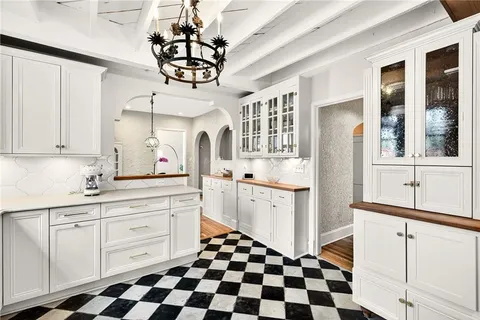 a bathroom with a sink a toilet and a window