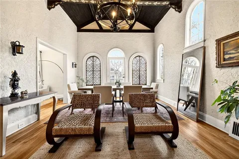 a view of a dining room with furniture and a fireplace