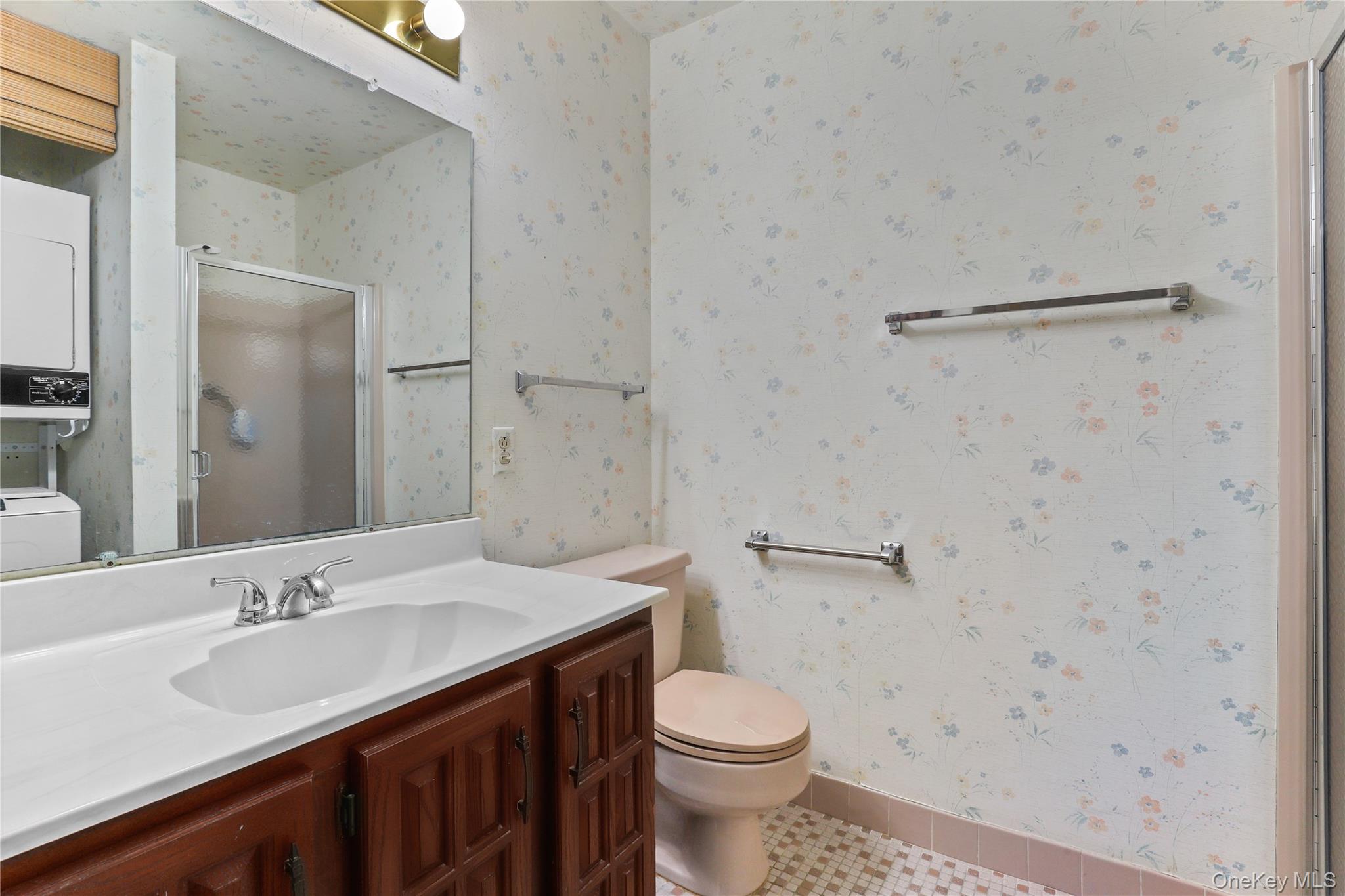 116 Village Road, Unit D Yorktown Heights, NY 10598 - Photo 15 of 32 a bathroom with a sink a toilet and shower