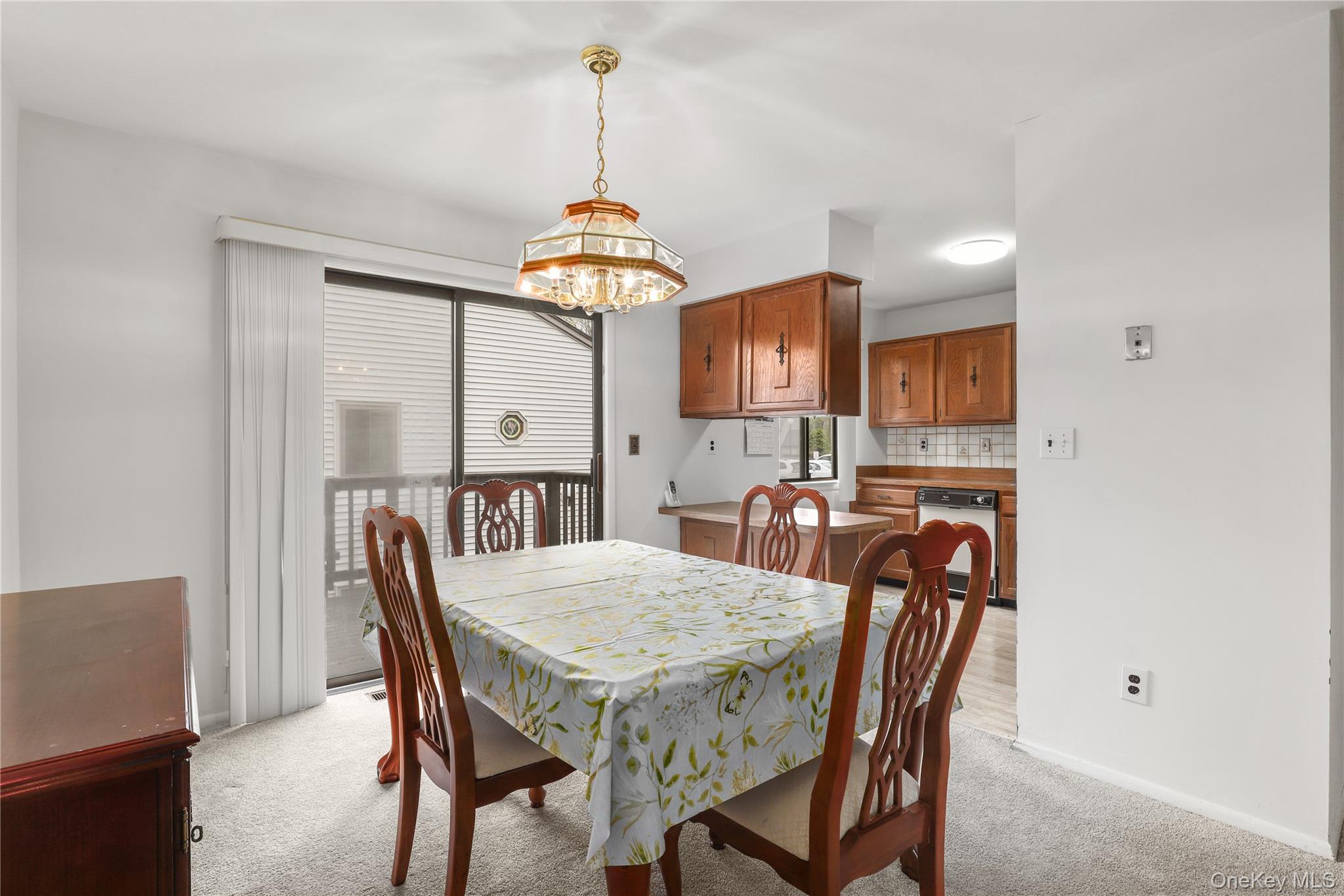 116 Village Road, Unit D Yorktown Heights, NY 10598 - Photo 6 of 32 a view of a dining room with furniture