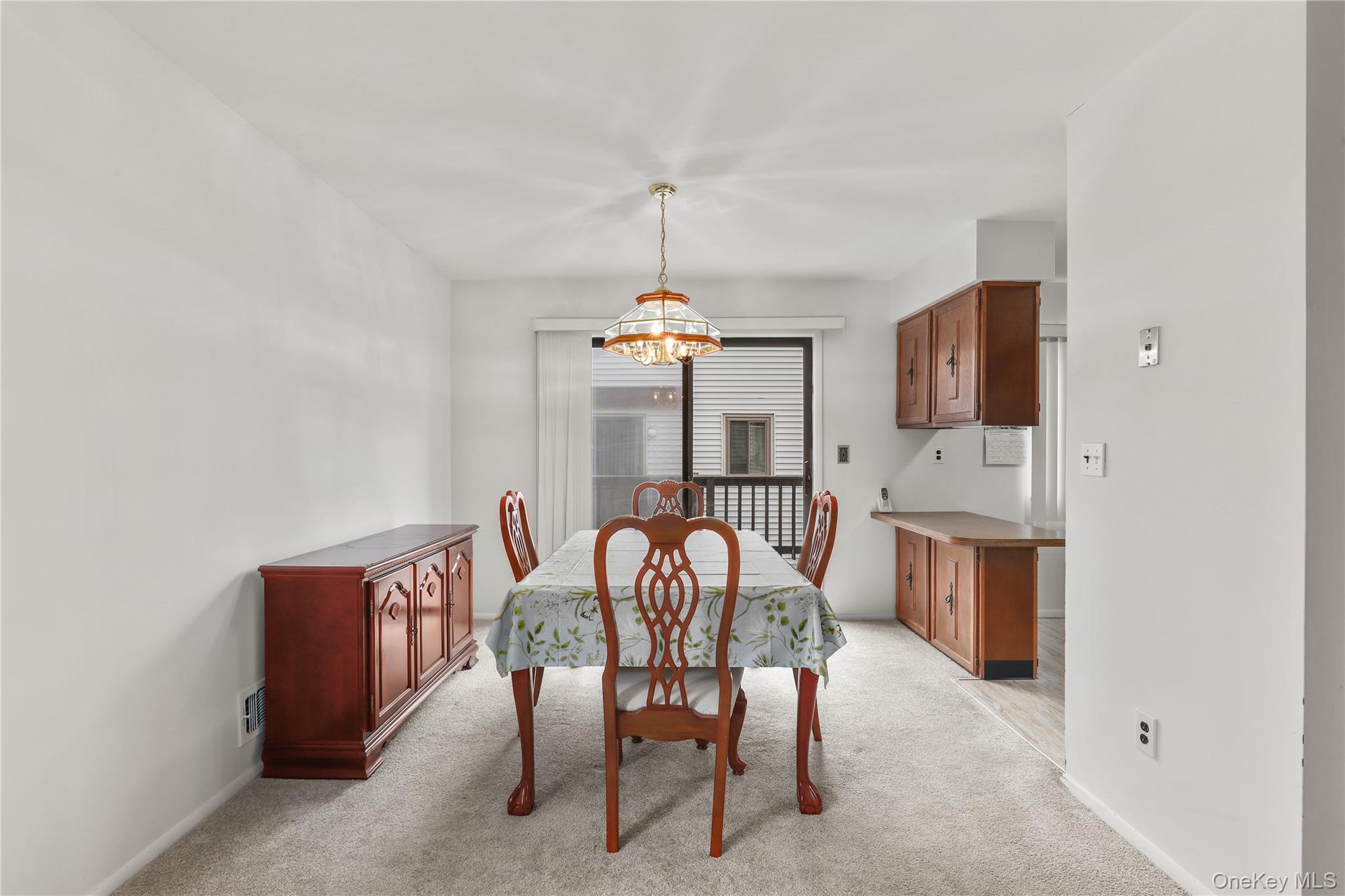 116 Village Road, Unit D Yorktown Heights, NY 10598 - Photo 7 of 32 a dining room with furniture and window