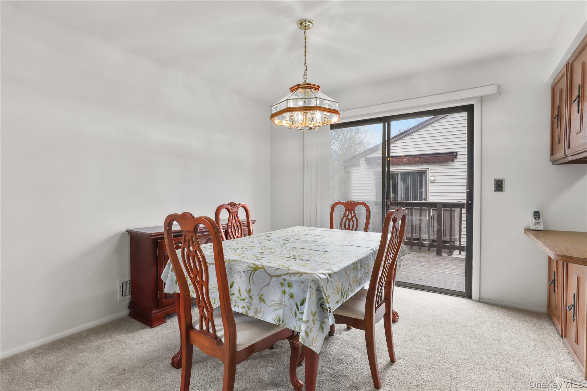 116 Village Road, Unit D Yorktown Heights, NY 10598 - Photo 8 of 32 a dining room with furniture and window