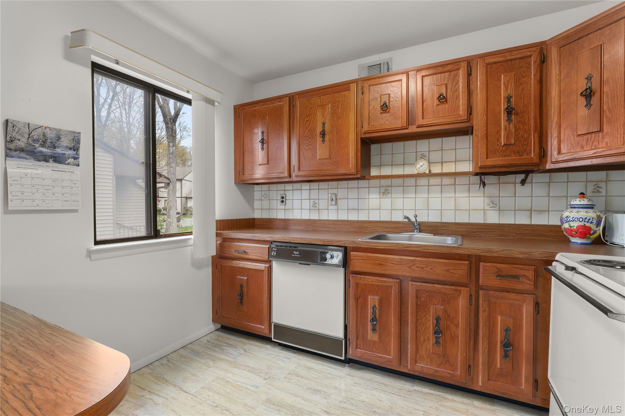 116 Village Road, Unit D Yorktown Heights, NY 10598 - Photo 10 of 32 a kitchen with stainless steel appliances granite countertop a sink stove and cabinets