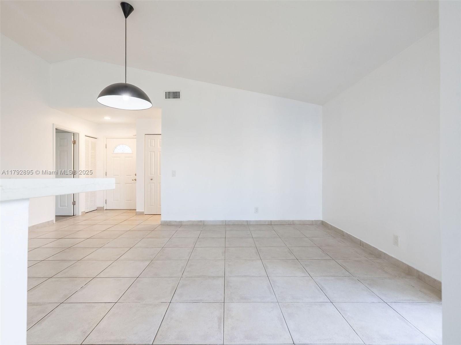 1225 Seagrape Circle Weston, FL 33326 - Photo 12 of 61 a view of an empty room with a window