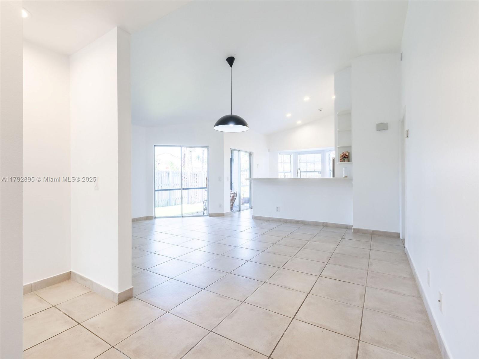 1225 Seagrape Circle Weston, FL 33326 - Photo 14 of 61 a view of a kitchen with a sink and a window