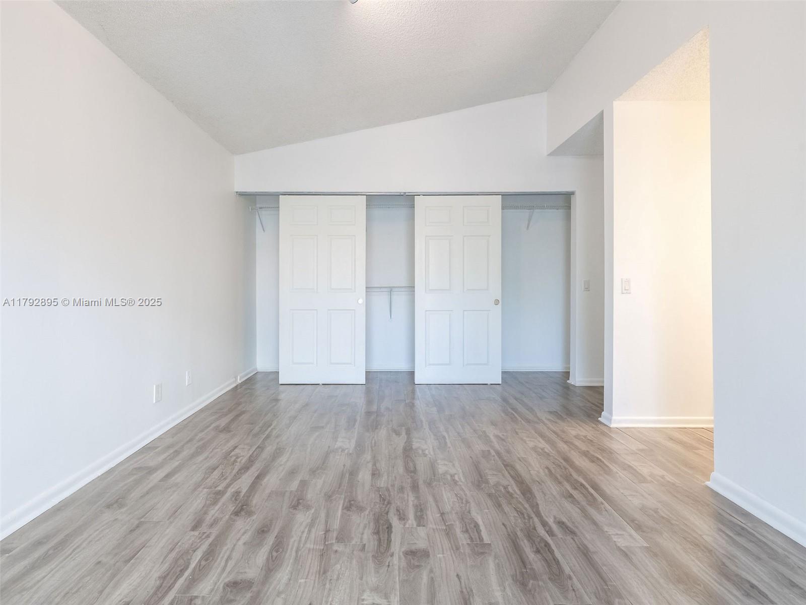 1225 Seagrape Circle Weston, FL 33326 - Photo 19 of 61 an empty room with wooden floor