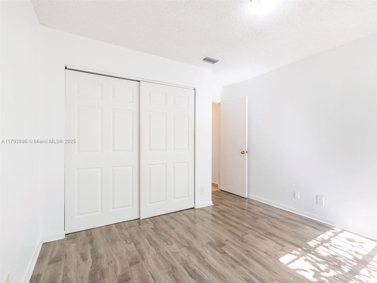 1225 Seagrape Circle Weston, FL 33326 - Photo 32 of 61 a view of an empty room