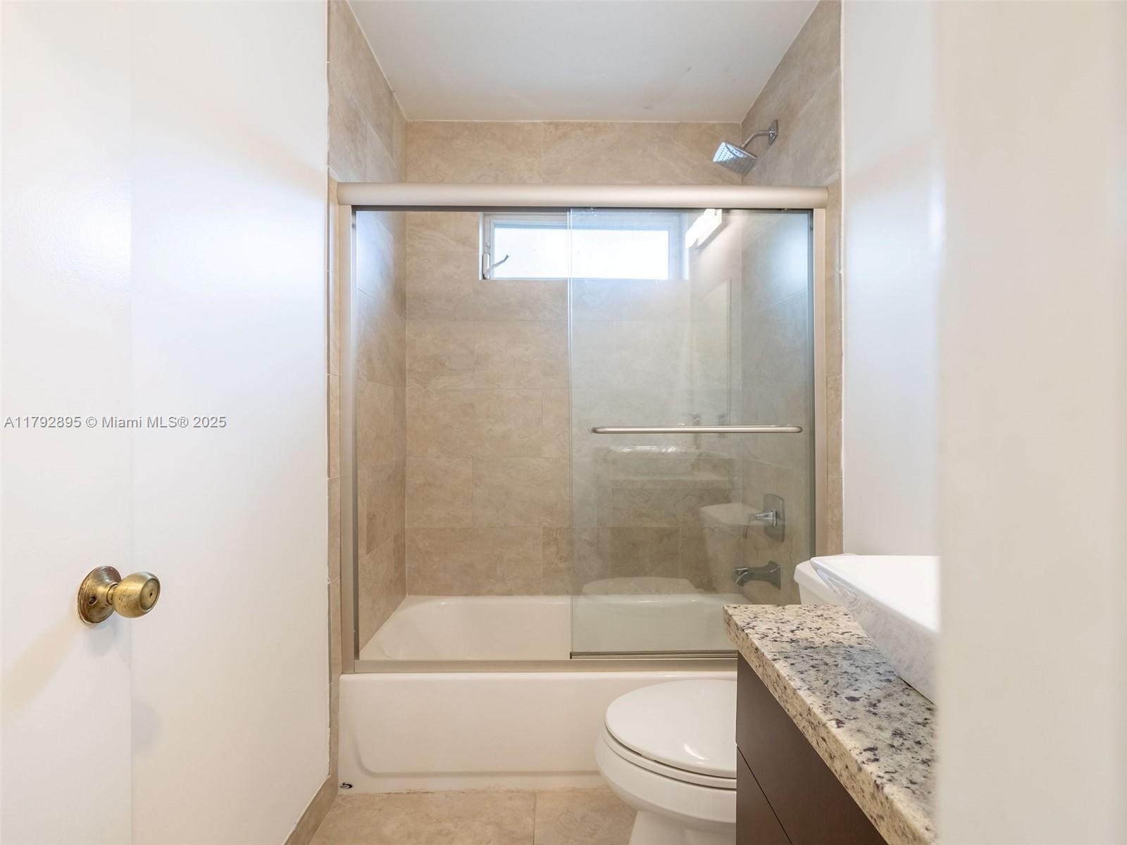 1225 Seagrape Circle Weston, FL 33326 - Photo 35 of 61 a bathroom with a granite countertop bathtub shower sink vanity and toilet