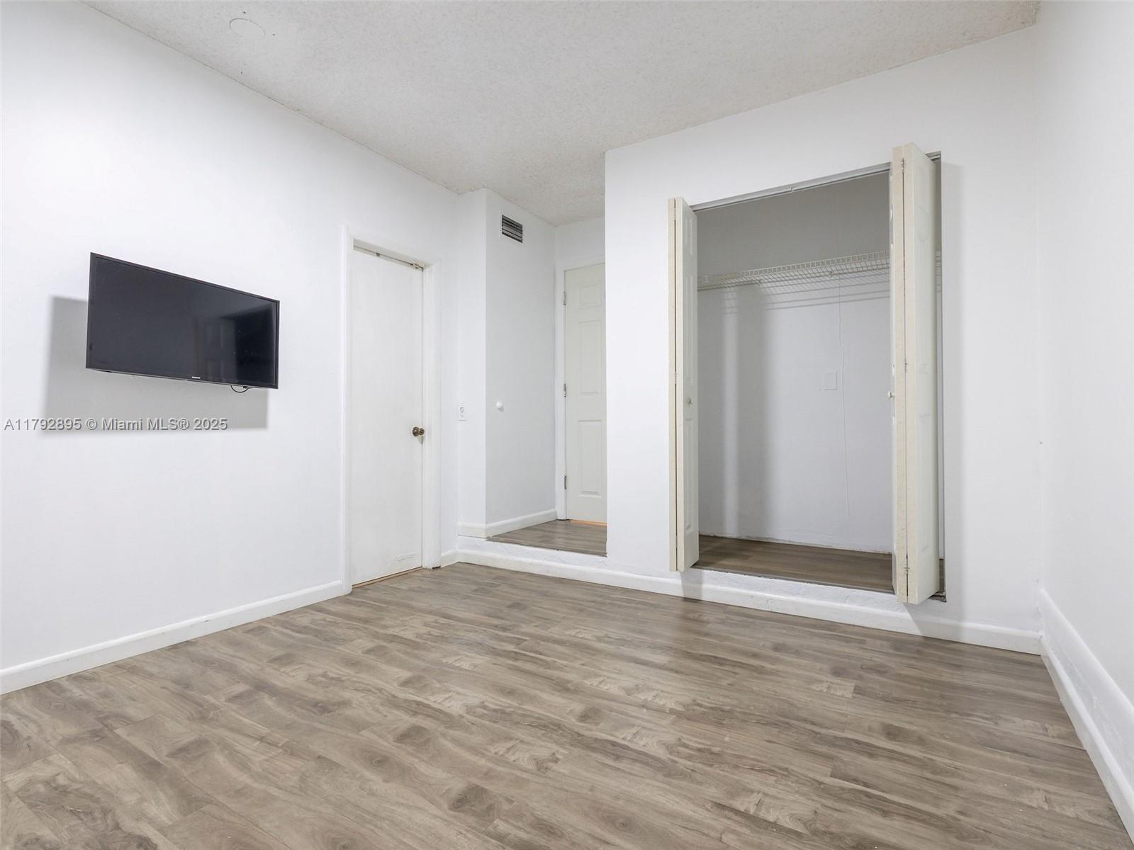 1225 Seagrape Circle Weston, FL 33326 - Photo 40 of 61 a view of a livingroom with wooden floor
