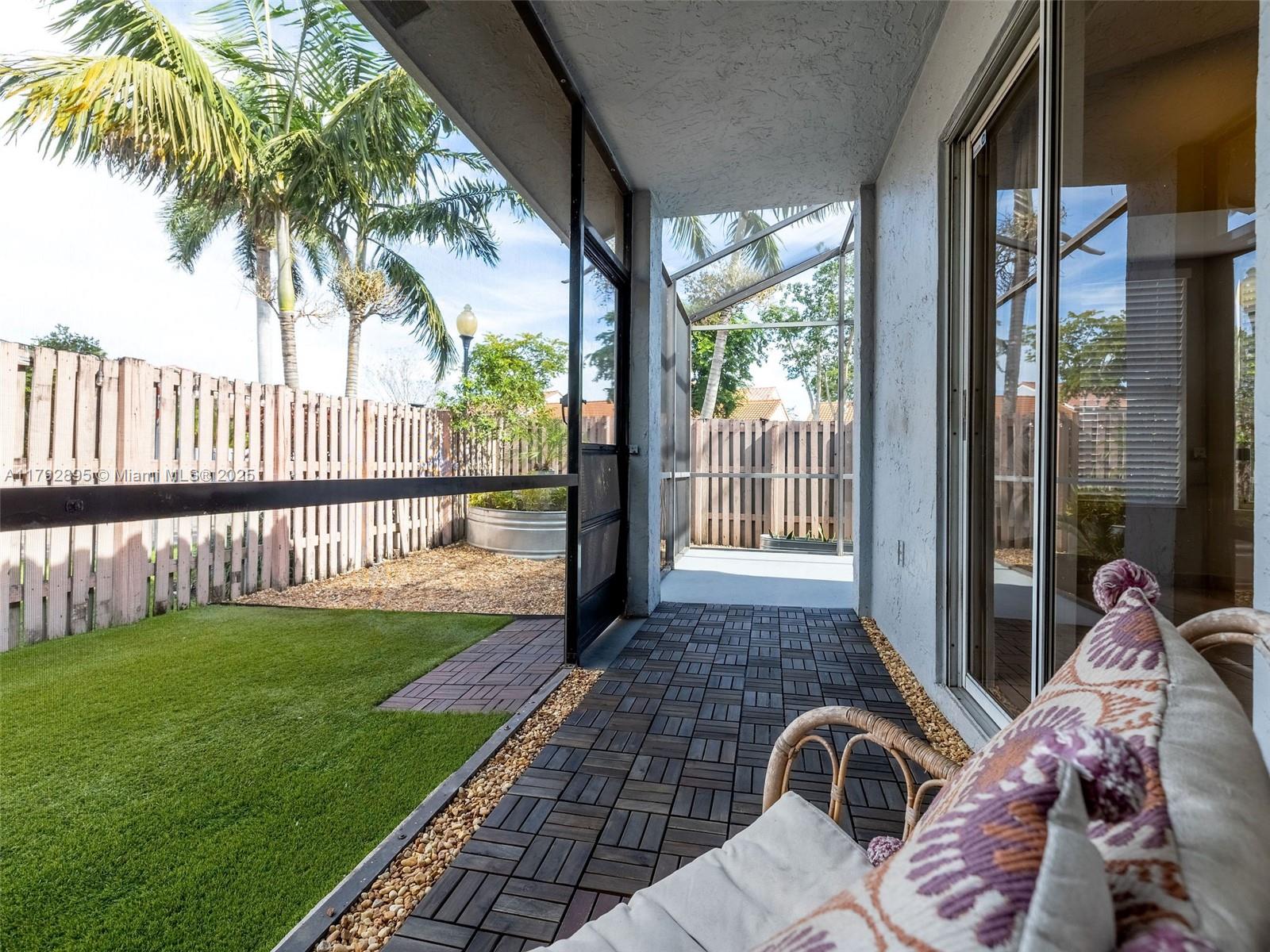 1225 Seagrape Circle Weston, FL 33326 - Photo 45 of 61 a view of a porch with a furniture