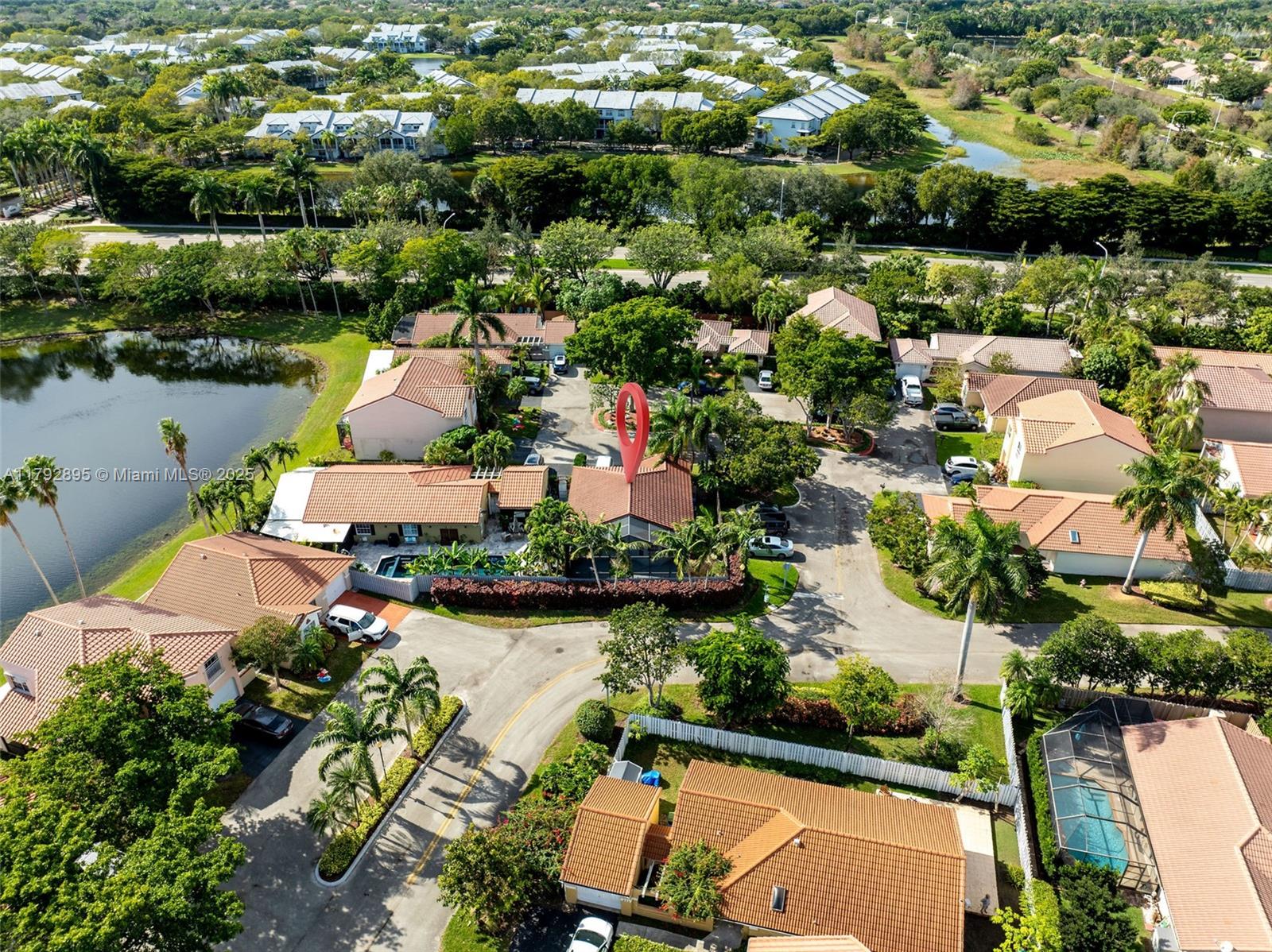 1225 Seagrape Circle Weston, FL 33326 - Photo 56 of 61 an aerial view of a house with a lake view