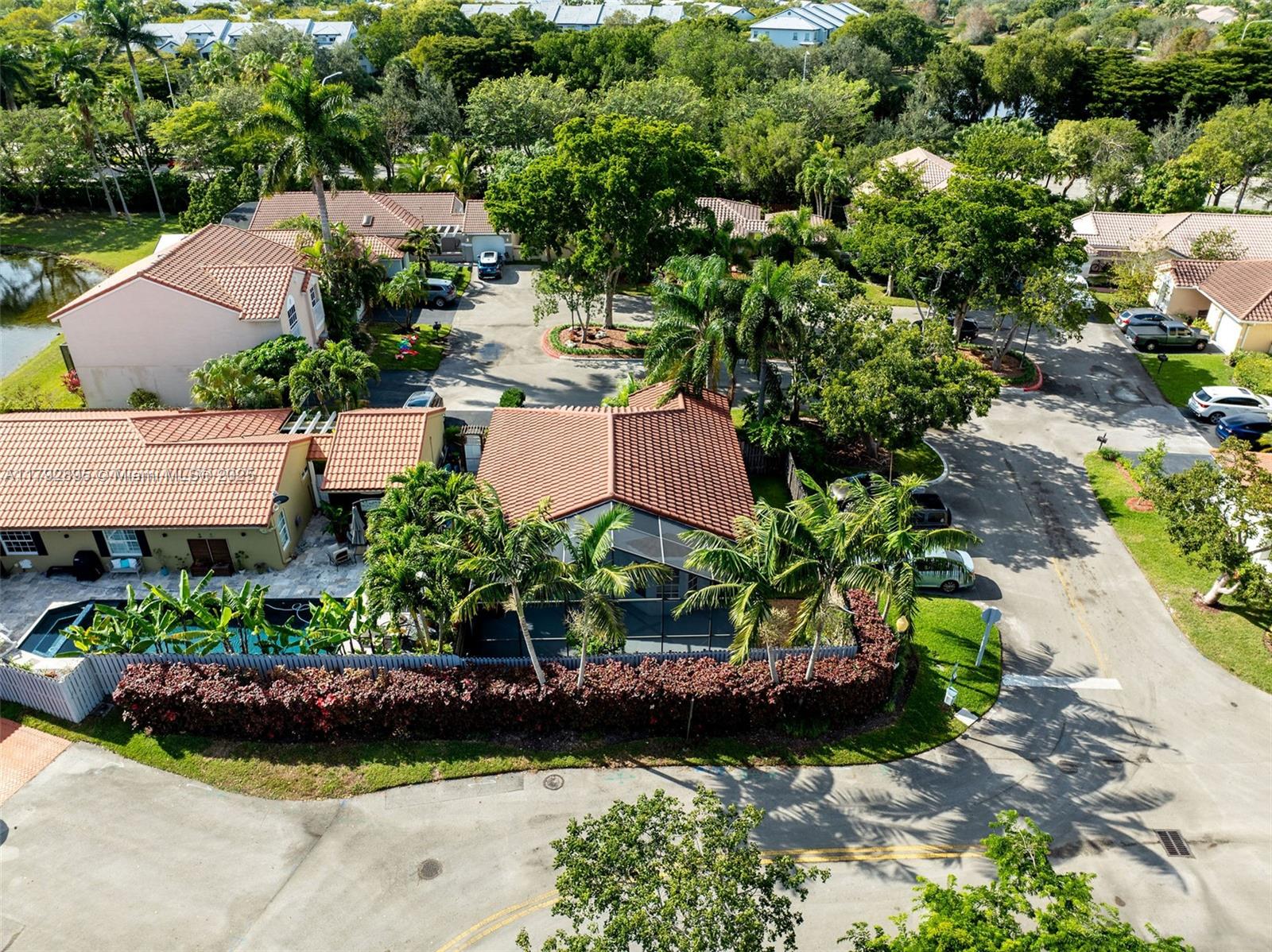 1225 Seagrape Circle Weston, FL 33326 - Photo 57 of 61 an aerial view of a house with a garden and yard