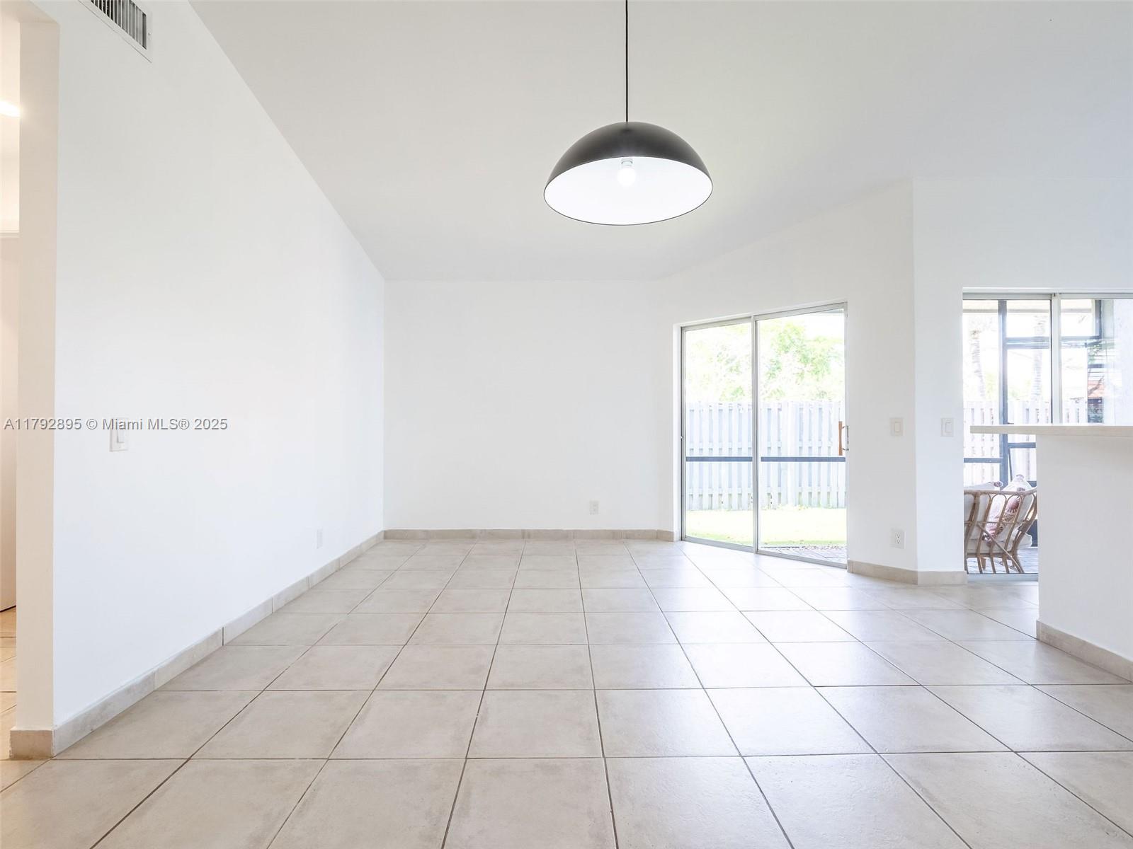 1225 Seagrape Circle Weston, FL 33326 - Photo 9 of 61 a view of an empty room with a window