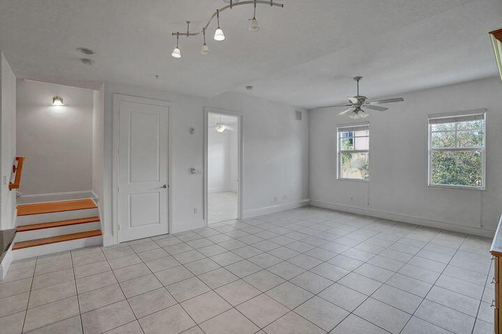 3120 East Latitude Circle, Unit 309 Delray Beach, FL 33483 - Photo 12 of 32 an empty room with windows and closet