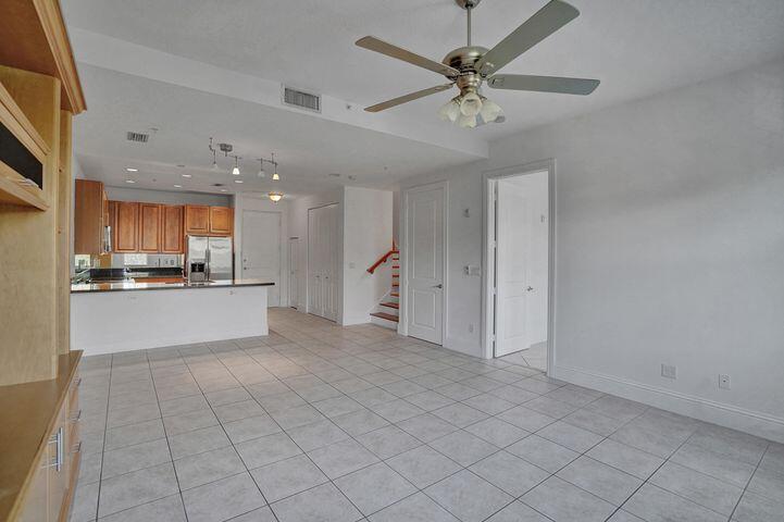 3120 East Latitude Circle, Unit 309 Delray Beach, FL 33483 - Photo 13 of 32 a view of an empty room and kitchen view