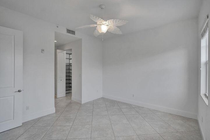 3120 East Latitude Circle, Unit 309 Delray Beach, FL 33483 - Photo 24 of 32 wooden floor in an empty room