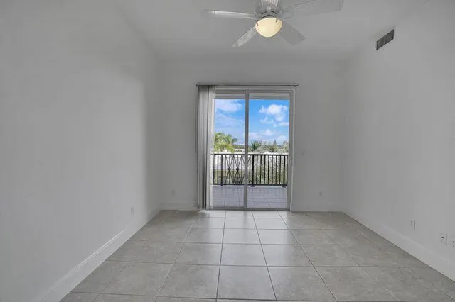 an empty room with floor to ceiling window