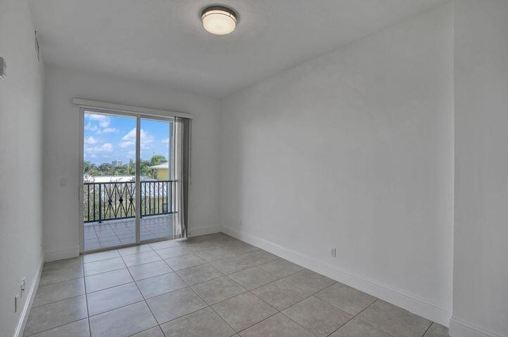 3120 East Latitude Circle, Unit 309 Delray Beach, FL 33483 - Photo 28 of 32 a view of a room with a large window