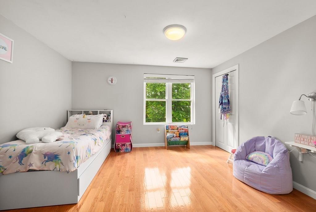 39 Williams Road Ashland, MA 01721 - Photo 16 of 30 a bedroom with a bed and wooden floor