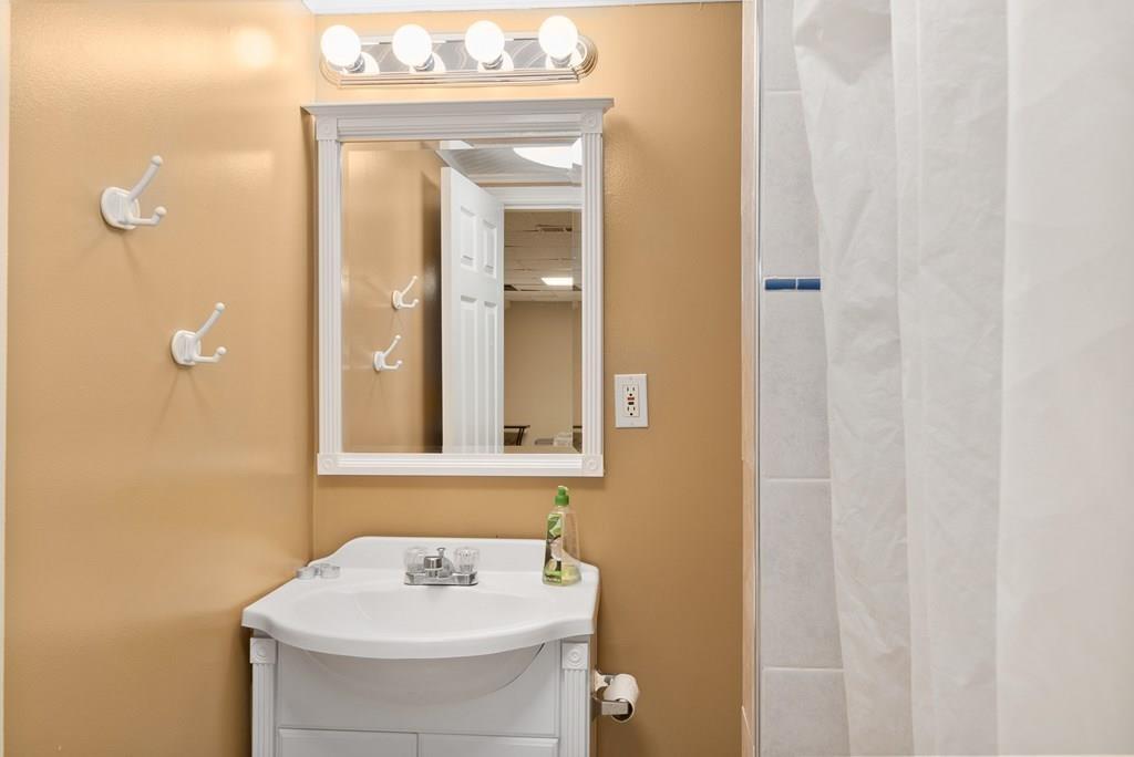 39 Williams Road Ashland, MA 01721 - Photo 20 of 30 a bathroom with a sink a mirror and a toilet