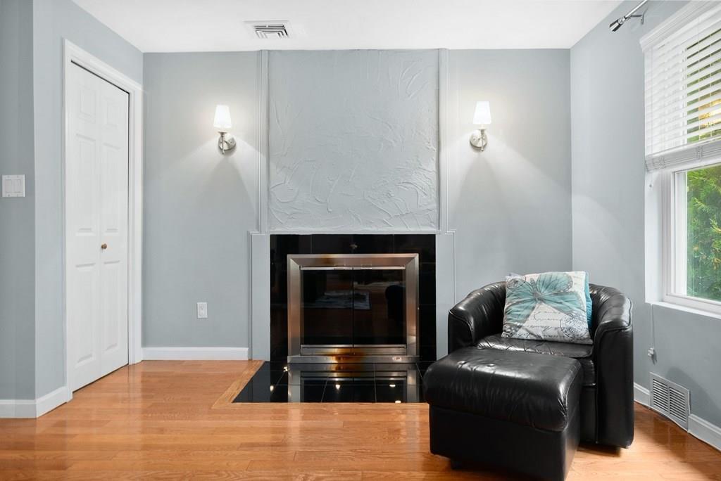 39 Williams Road Ashland, MA 01721 - Photo 4 of 30 a living room with furniture and a fireplace