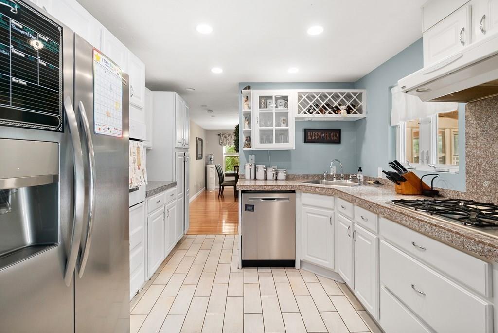 39 Williams Road Ashland, MA 01721 - Photo 5 of 30 a kitchen with stainless steel appliances a refrigerator sink and cabinets