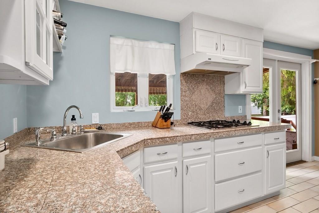 39 Williams Road Ashland, MA 01721 - Photo 7 of 30 a kitchen with stainless steel appliances granite countertop a sink stove and cabinets