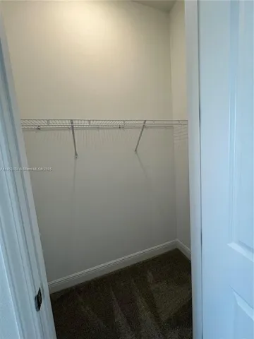 a view of small space with racks on the wall