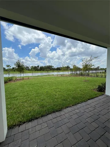 a view of a lake with a big yard