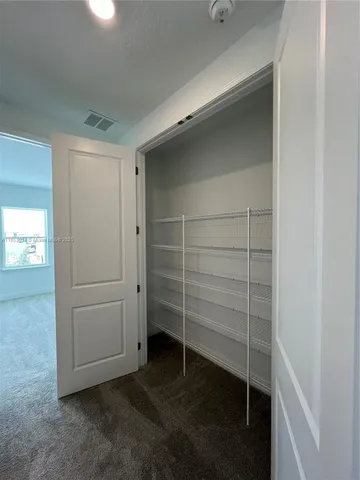 a view of an empty walk in closet