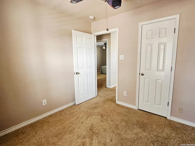 an empty room with closet area