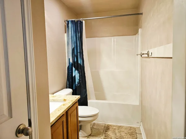 a bathroom with a shower and a toilet