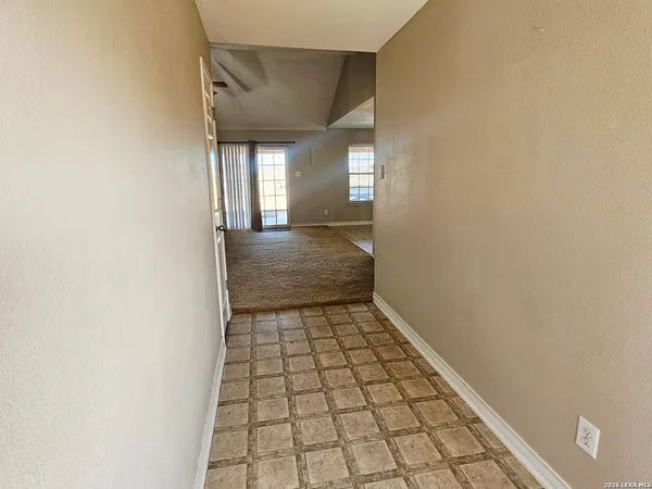 a view of an empty room and window